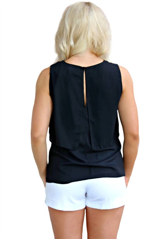 SLEEVELESS BLOUSE WITH FLAT RUFFLE