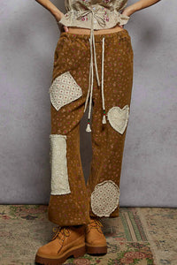 POL Relaxed Floral Joggers in ochre - women's pants - detail view