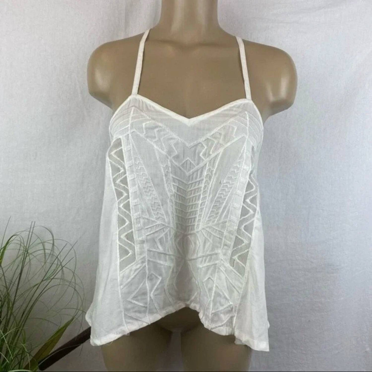 Kiwi Tucker - Peplum Sleeveless Top