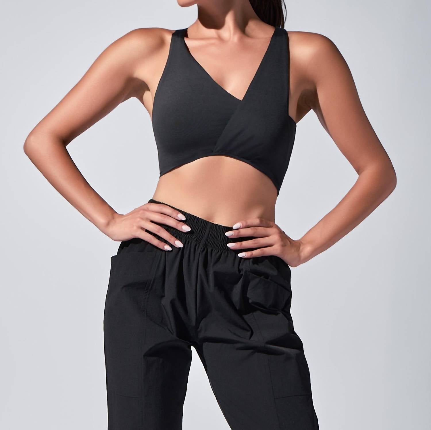 HEROINE SPORT Twisted Symmetric Neck Top in black - women's tank top - detail view