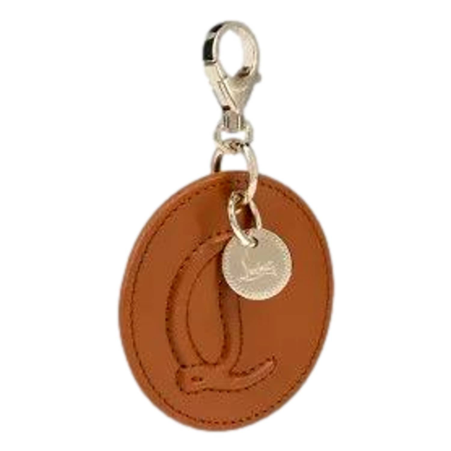 Christian Louboutin Women's Round Leather Logo Bag Charm Keychain in brown - women's item - alternate view