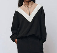 THE GREAT. The Colorblock Plush Chalet Sweatshirt in black - women's top - detail view