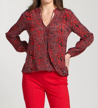 Apny - Crossover Printed Long Sleeve Blouse