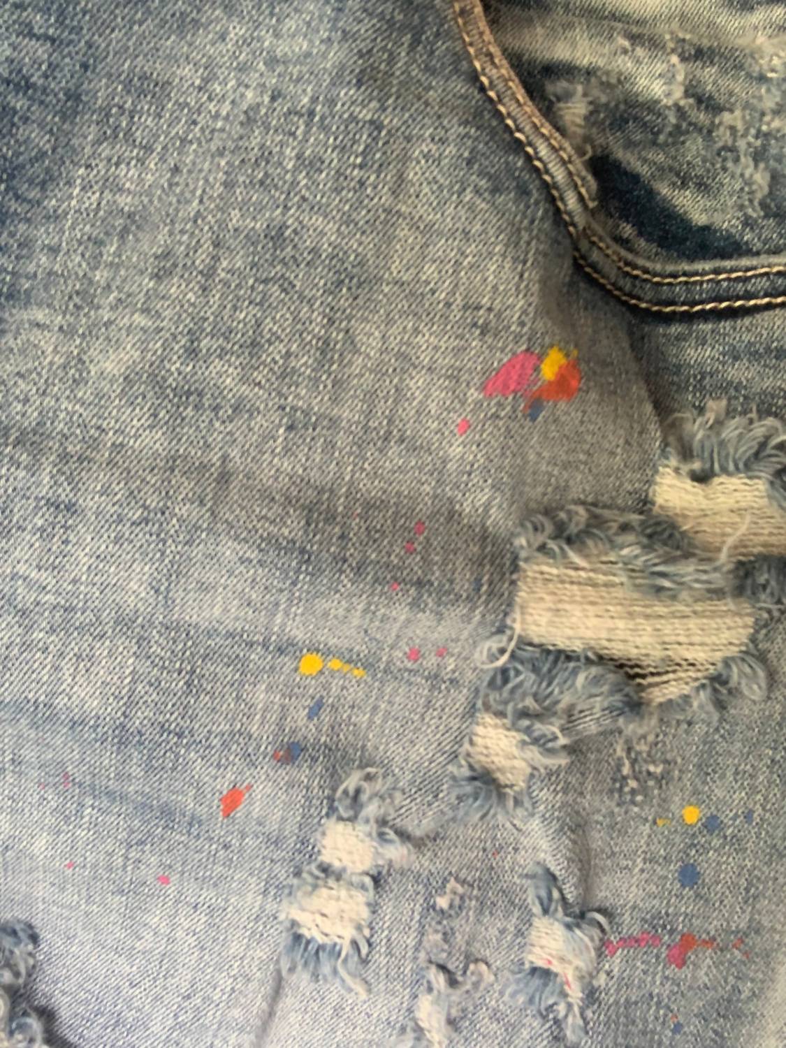 Judy Blue - Mid Rise Rainbow Paint Splash Cutoff Destroyed Shorts