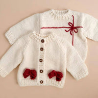 The Blueberry Hill Kid's Cozy Knit Cardigan With Bow in cream red - kids' sweater - alternate view