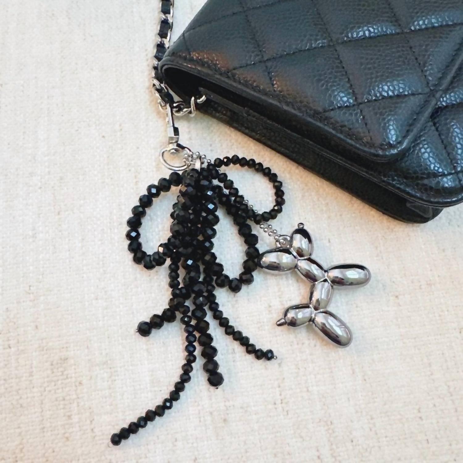 Ellison+Young Women's Balloon Dog Bag Charm And Beaded Bow Keychain in black silver - women's accessory - detail view
