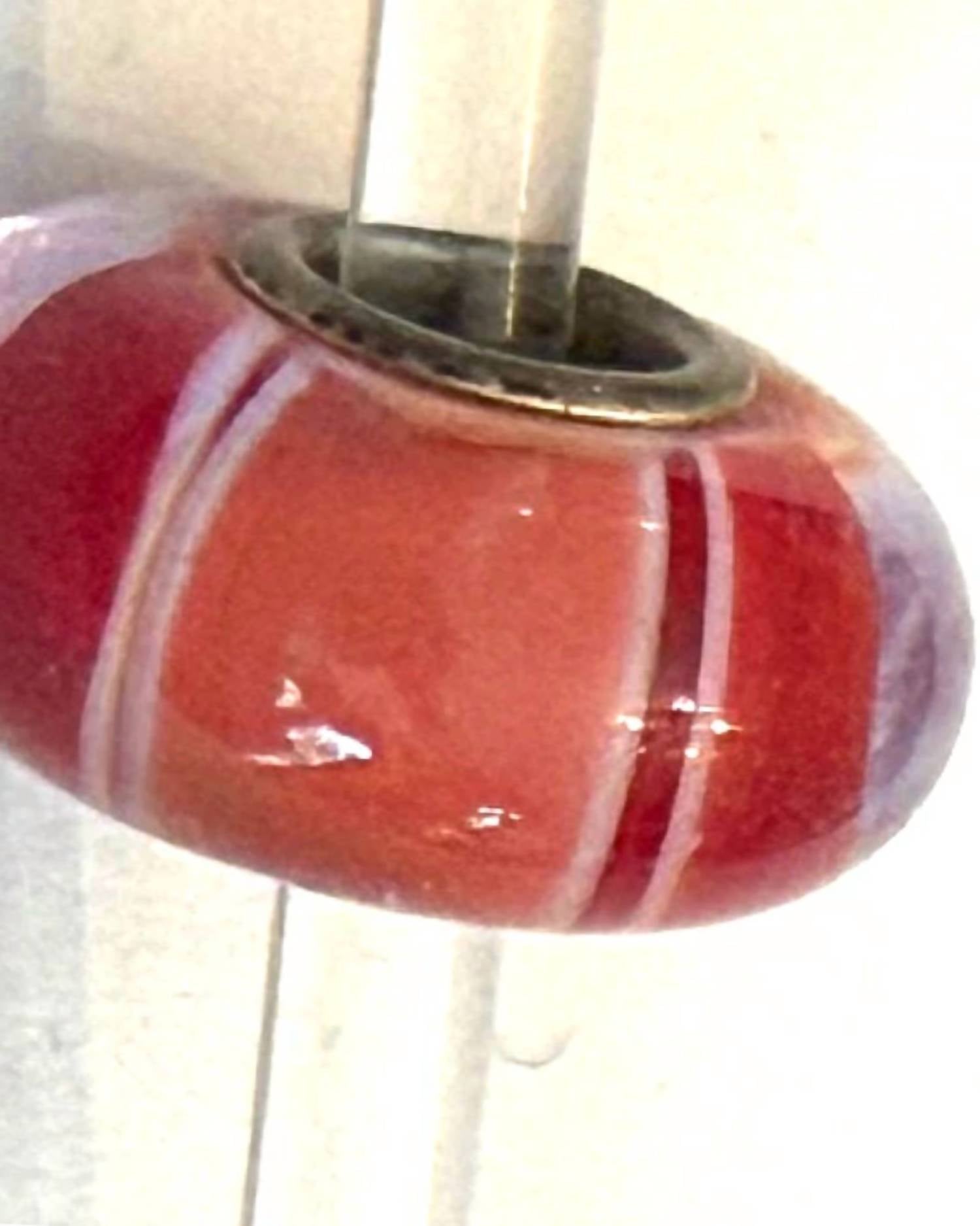 Trollbeads Women's Universal Charm Bead in unique red peach stripe - women's item - detail view