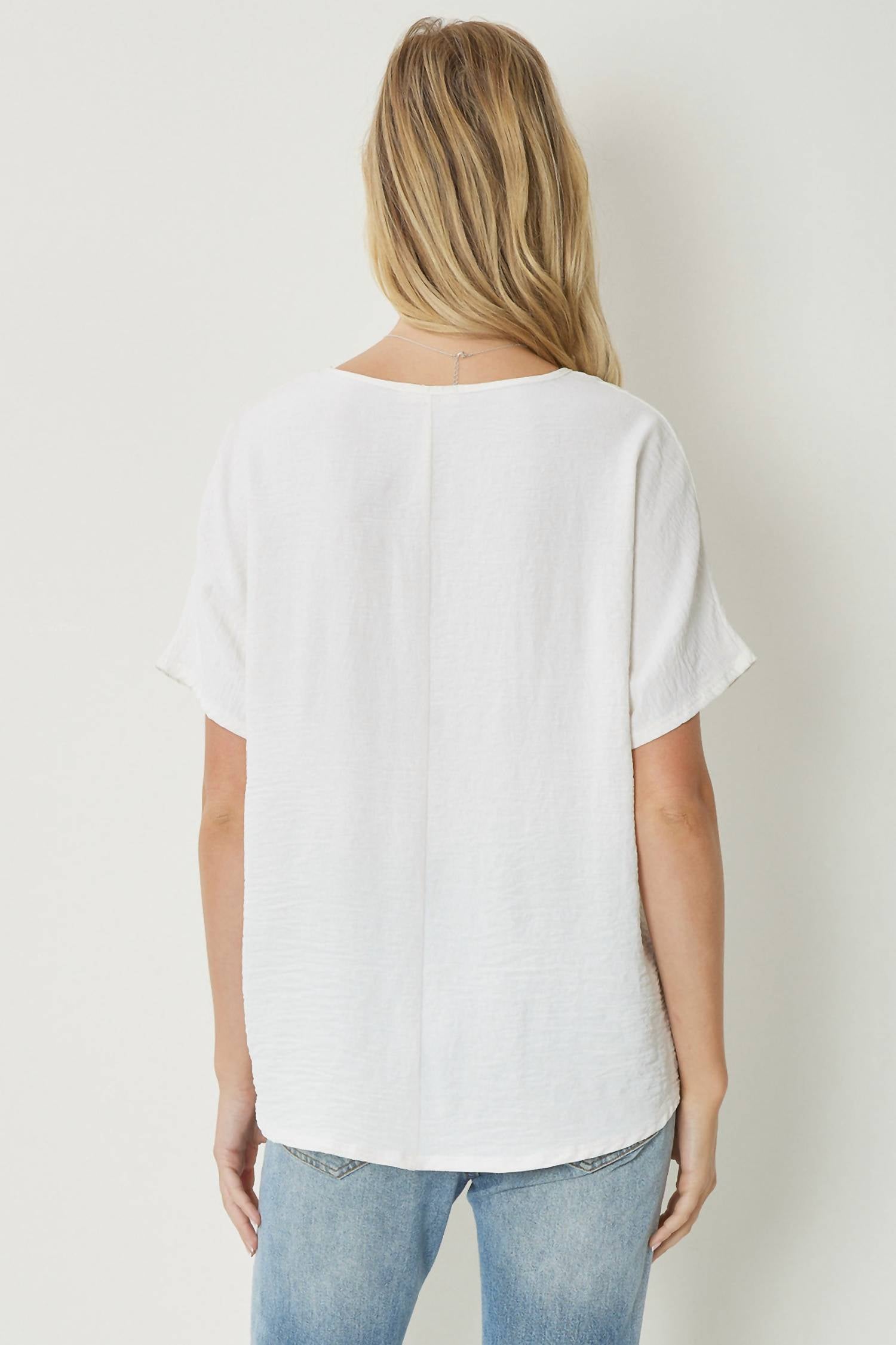 entro Solid V-neck Top in off white - women's blouse - detail view