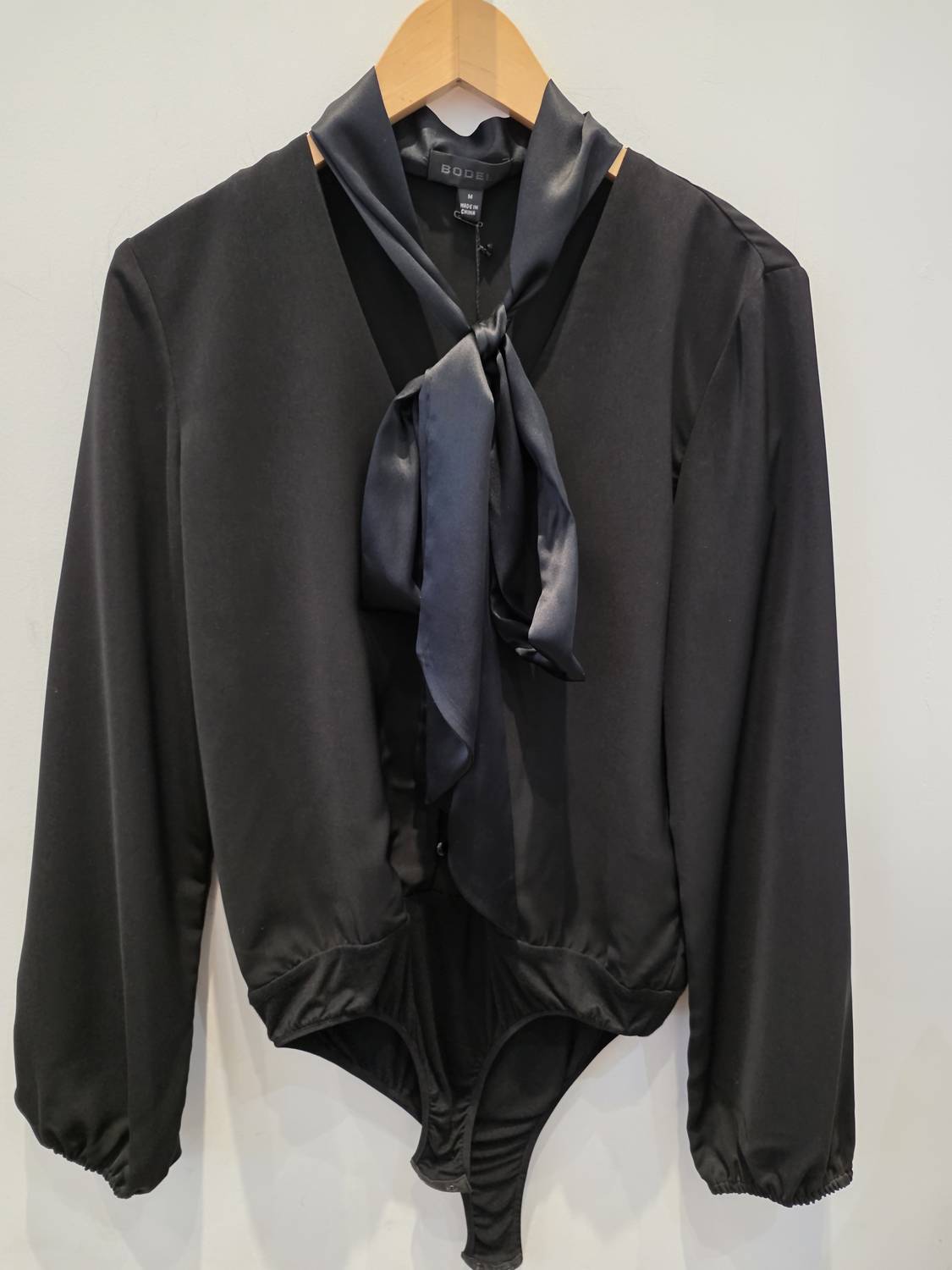 Sheri Bodell Women's Tie Up Ribbon Bodysuit in black - women's shirt