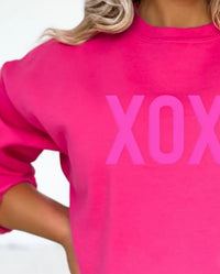The White Invite Xoxo Embossed Sweatshirt in pink - women's top - detail view