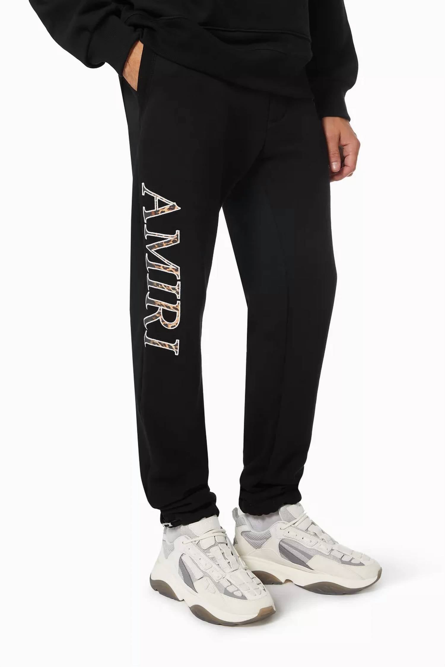 Amiri Leopard Applique Sweatpants in black - men's pants - view 5