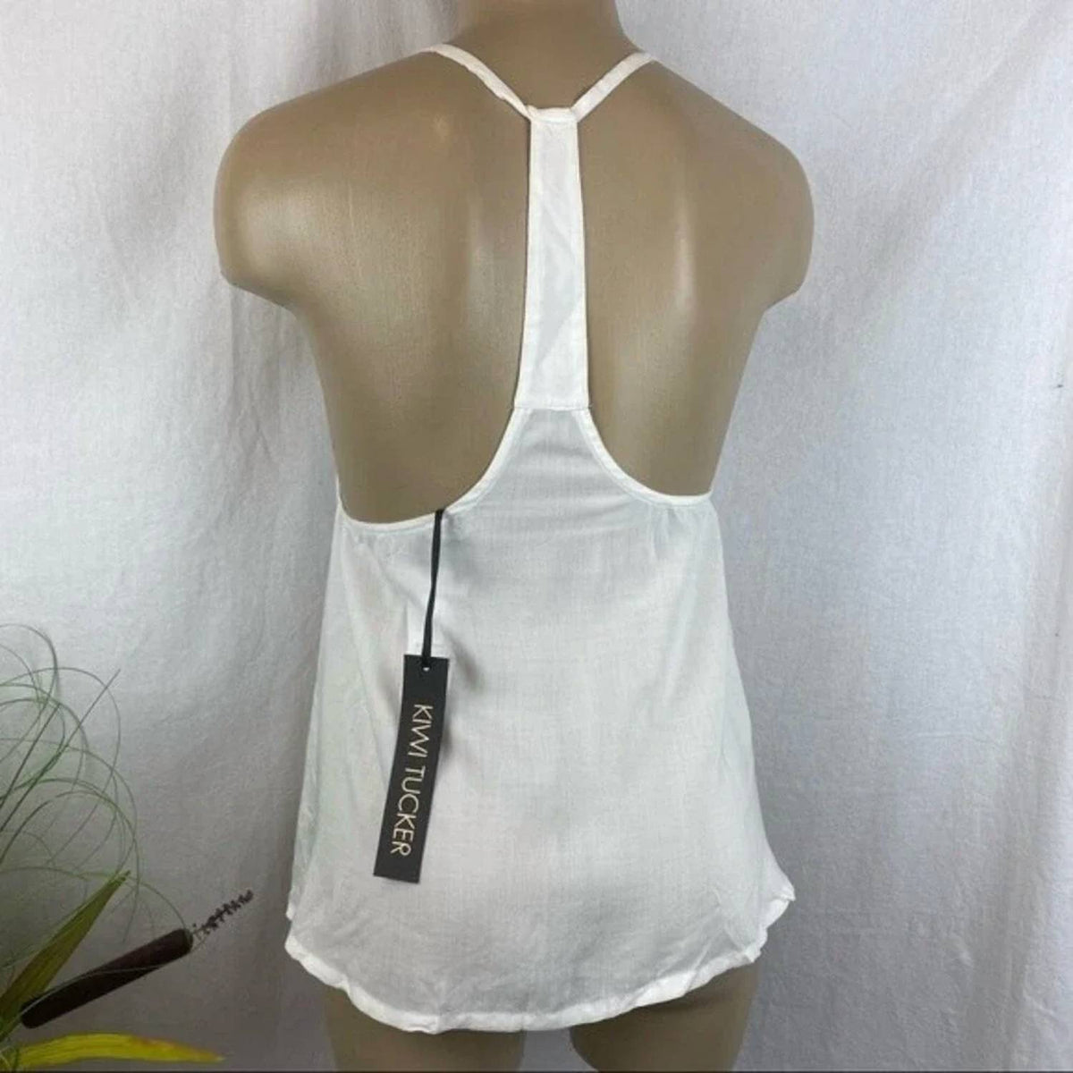 Kiwi Tucker - Peplum Sleeveless Top