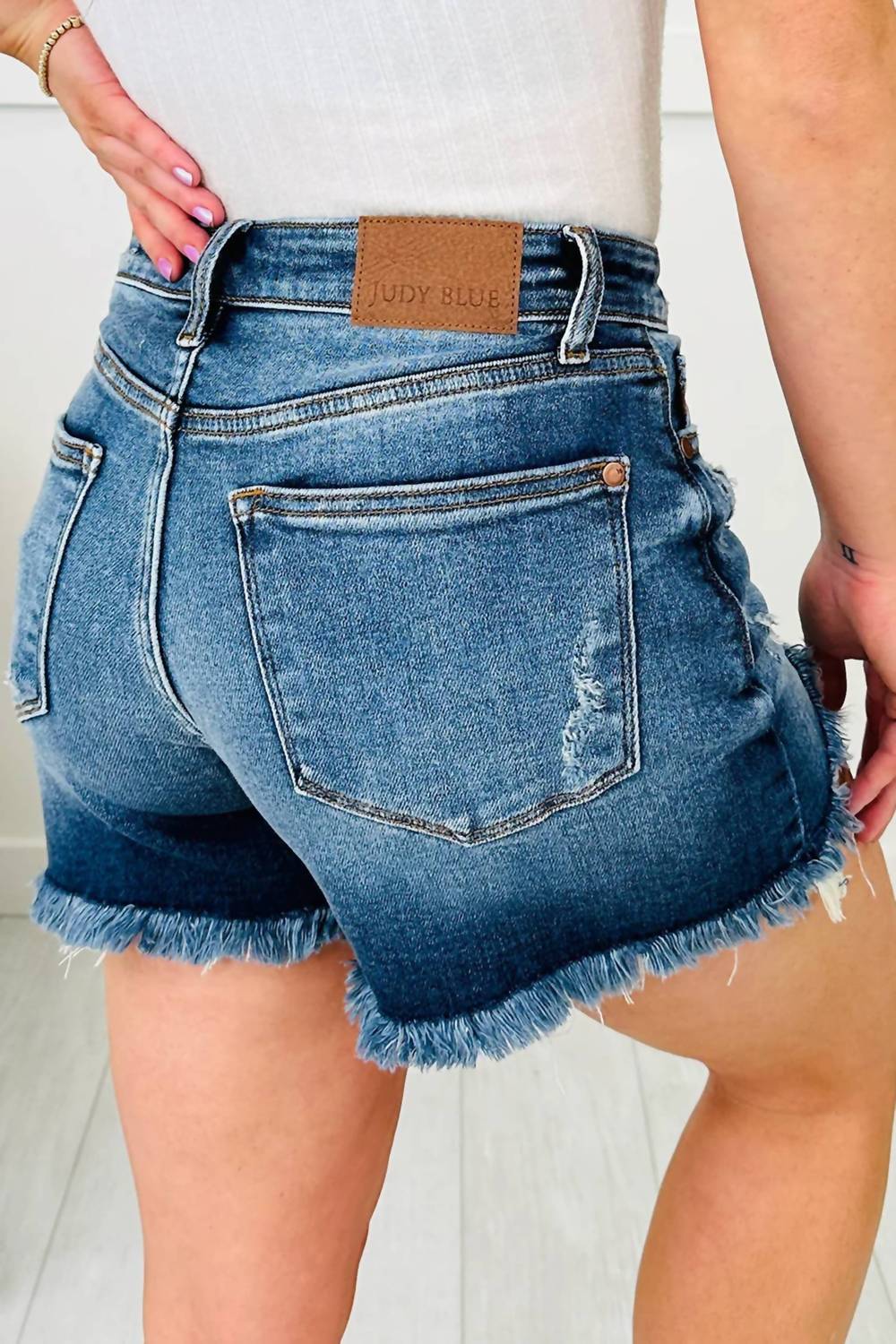 66Disco - Asymmetric Raw Hem Distressed Whiskery Denim Shorts