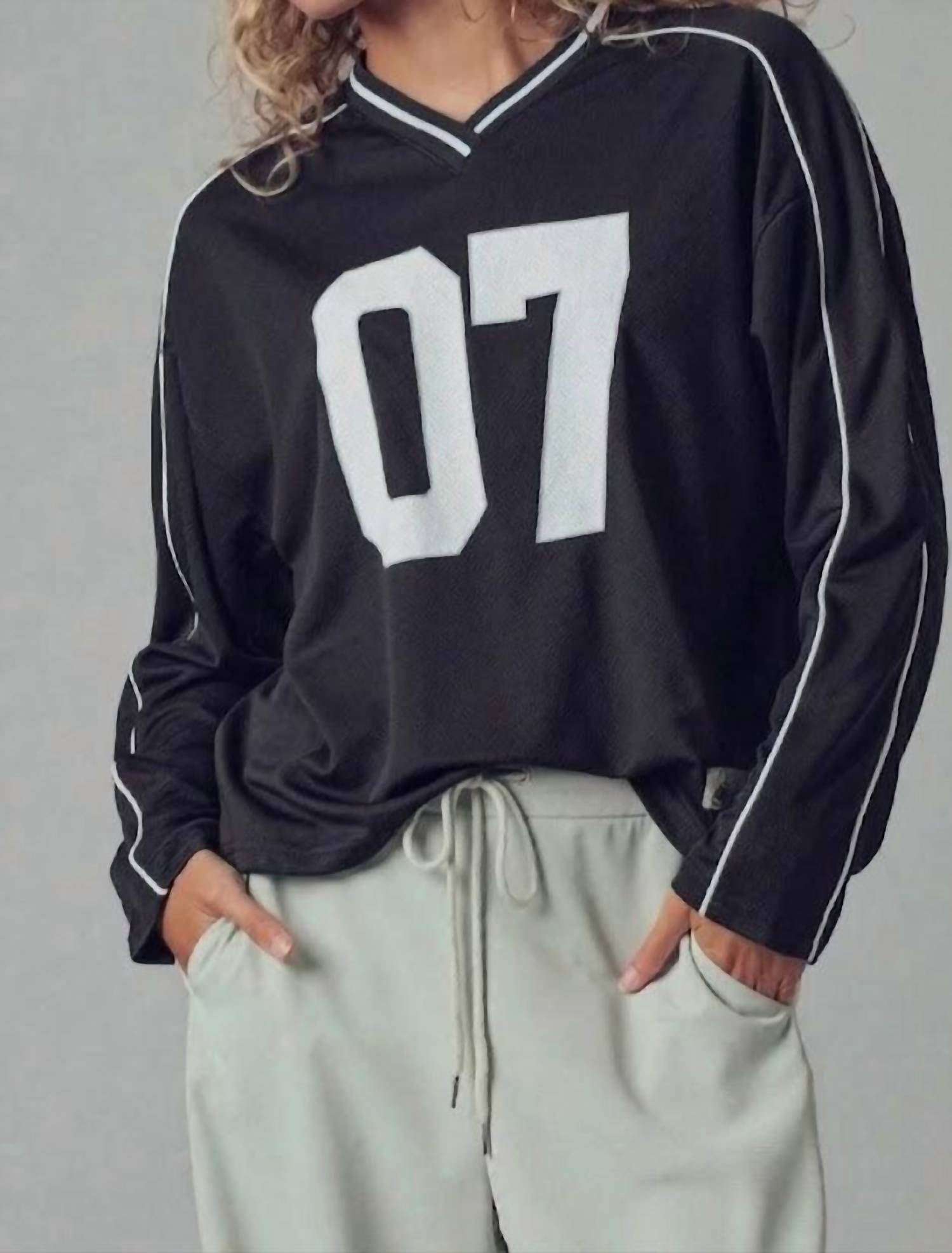 Urban Daizy Varsity 07 Graphic V-neck Jersey Top in black - women's long sleeve top - detail view