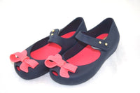Mini Melissa Girl's Ultragirl Bow Flat Shoes in pink black - kids' shoe - detail view