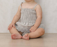 Quincy Mae Girls Smocked Skirted Romper in sage gingham - kids' item - detail view