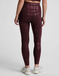 BEYOND YOGA High Waisted Midi Legging in plaid foil burgundy - women's pants - detail view