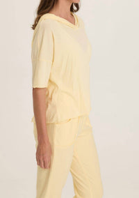 Wearables Lunaria Coen Jersey Short Sleeve Hooded Tee in luscious butter yellow - women's top - detail view