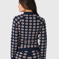 THE GREAT. Merino Quarter Zip Floral Print Top in blue - women's top - detail view