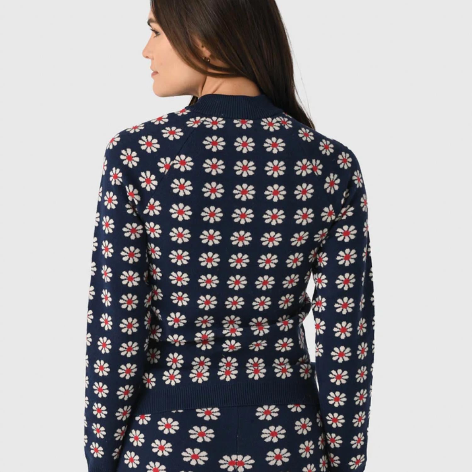 THE GREAT. Merino Quarter Zip Floral Print Top in blue - women's top - detail view