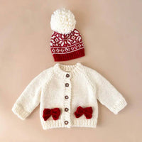 The Blueberry Hill Kid's Cozy Knit Cardigan With Bow in cream red - kids' sweater