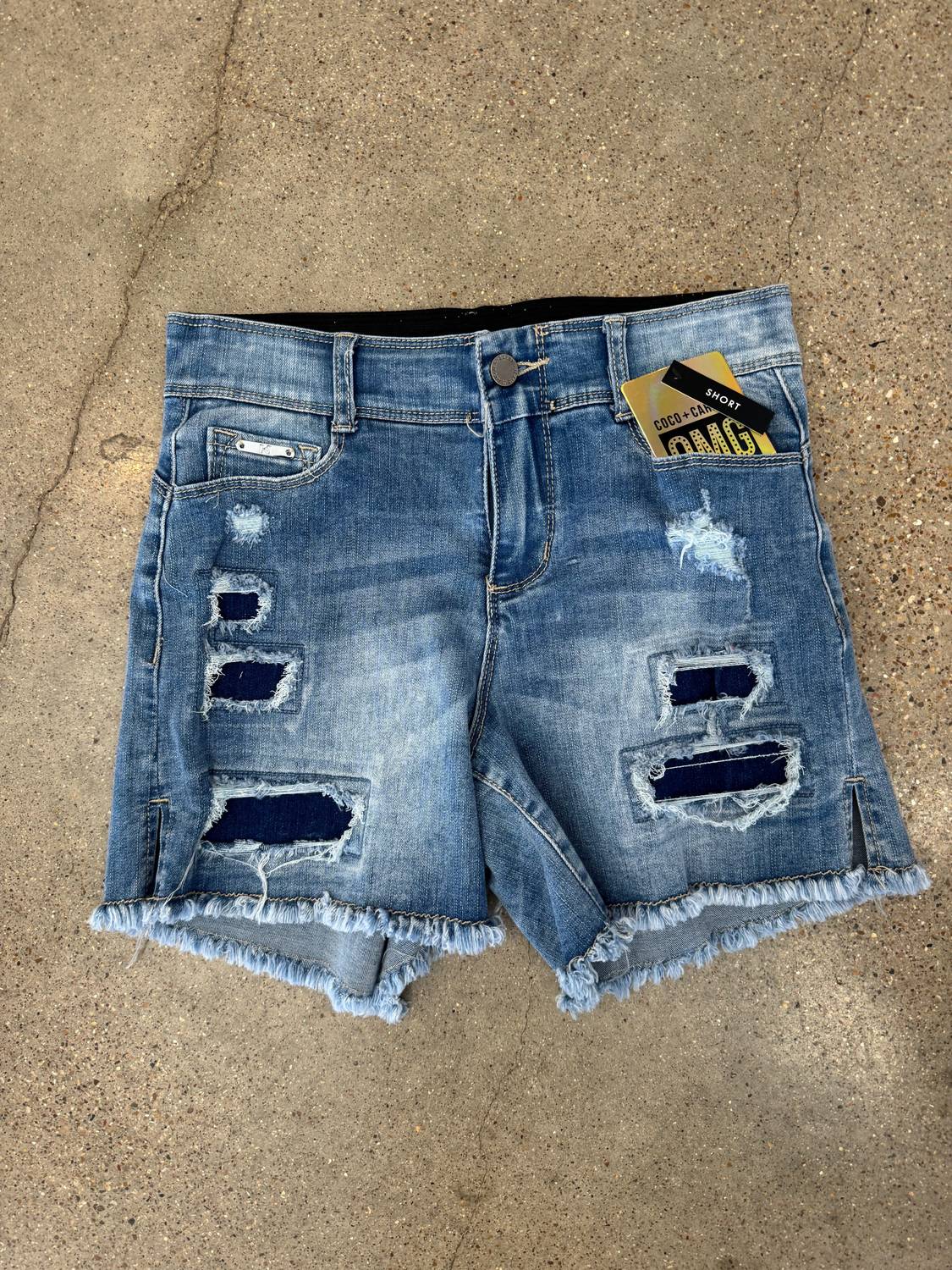 COCO + CARMEN Women's Ripped Jean Shorts in blue - women's shorts - detail view