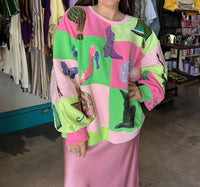 QUEEN OF SPARKLES Licensed Checkered Wicked Icon Sweatshirt in lavender pink green - women's top
