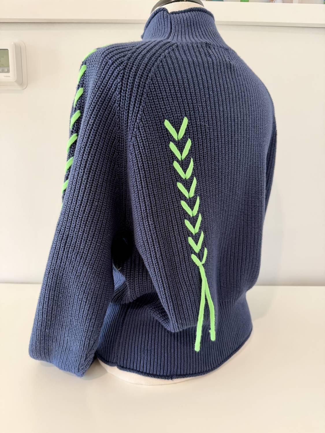 Wispr Women's Presley Plait Mock Neck Sweater in navy neon green - women's sweater - detail view
