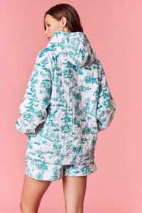 Peach Love Christmas Sights Quilted Hoodie in white green - women's top - detail view
