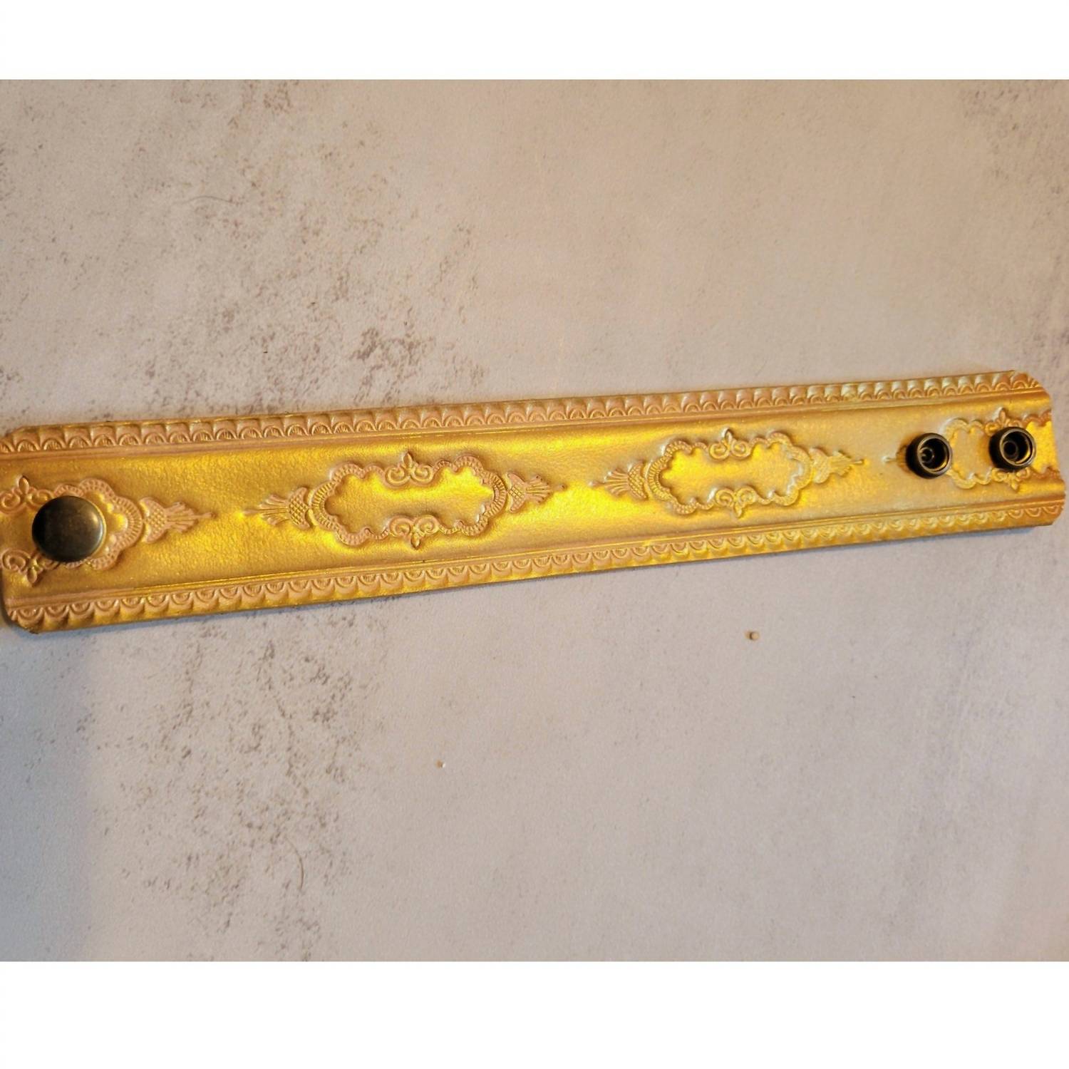 A Rare Bird Hand-tooled Leather Bracelet in gold brown - women's jewelry - detail view