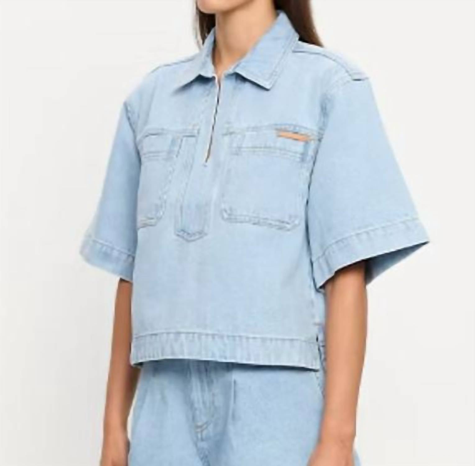 KIVARI Avery Denim Top in dusty blue - women's t-shirt - detail view