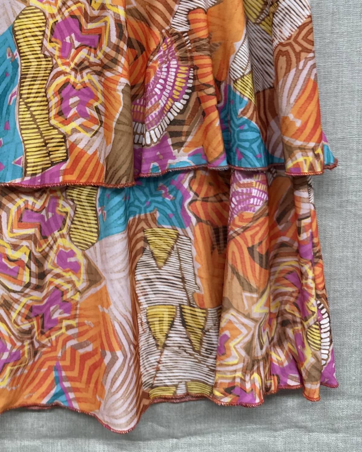 Fashque Women's 3 Tier Ruffle Skort in orange yellow pink - women's shorts - detail view