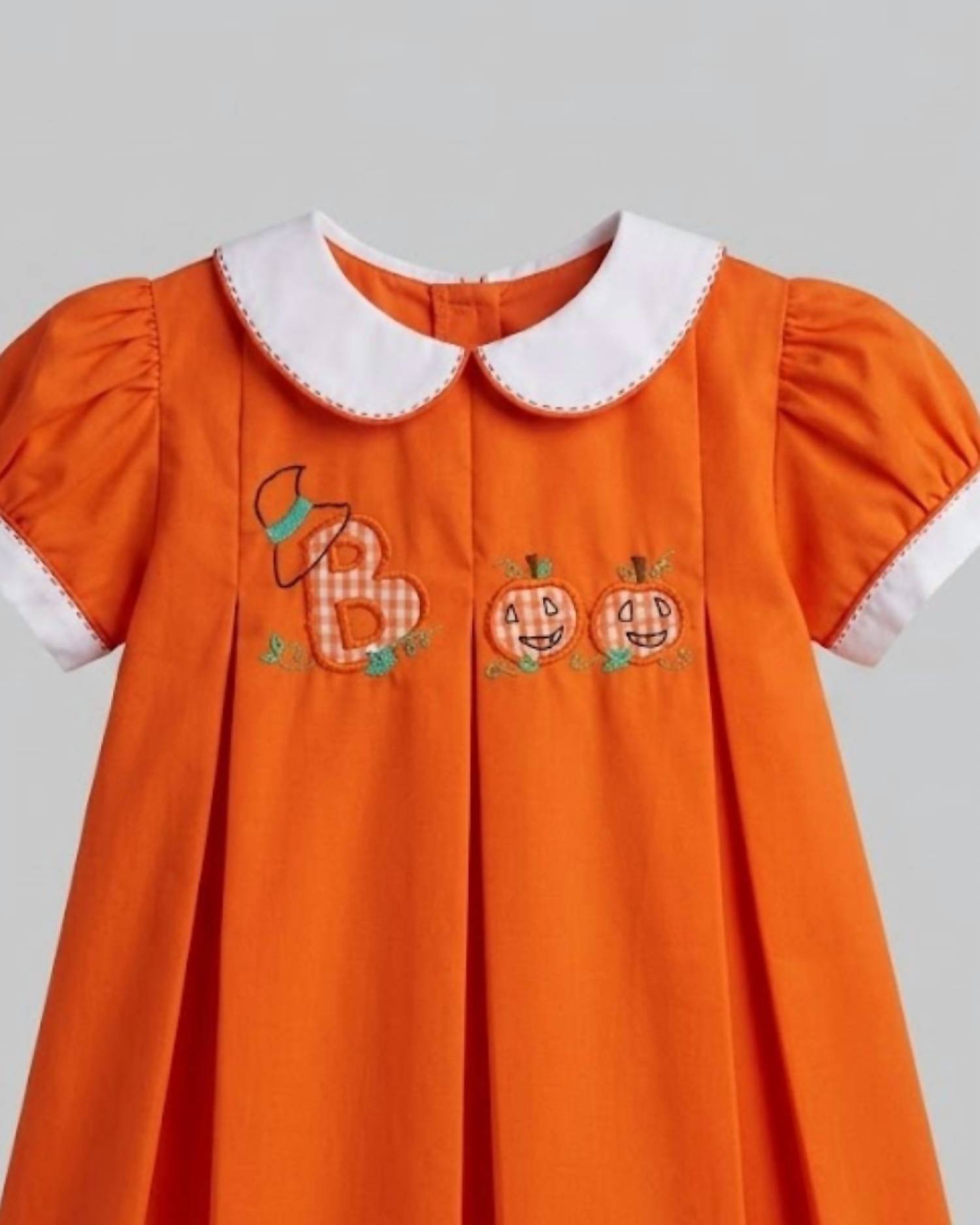 THE PROPER PEONY Girl's Aboo Pleated Dress in orange - kids' dress - detail view