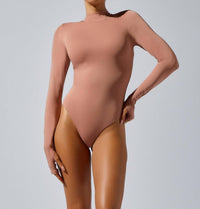 HEROINE SPORT Mock Neck Bodysuit in blush - women's shirt