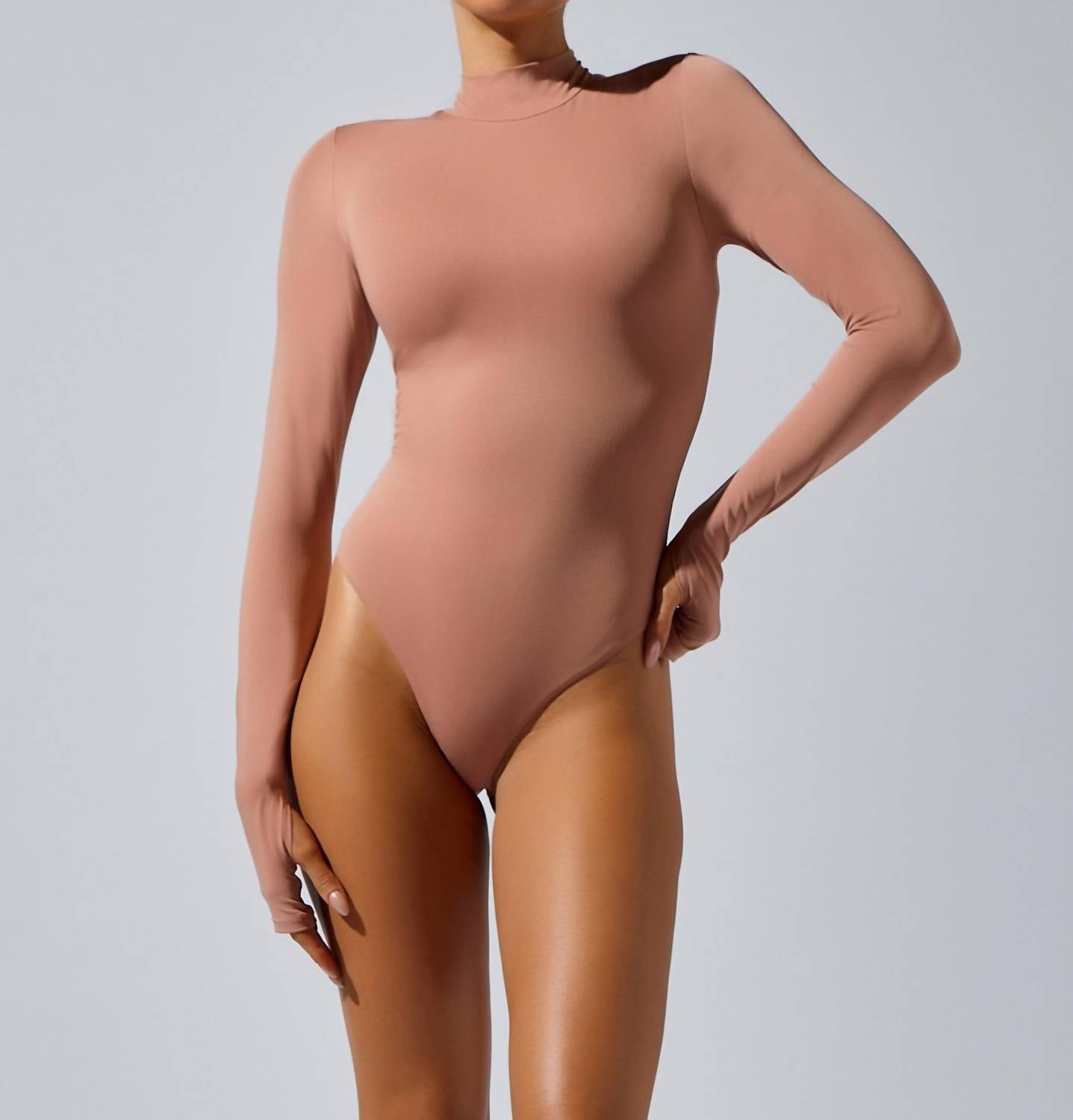 HEROINE SPORT Mock Neck Bodysuit in blush - women's shirt