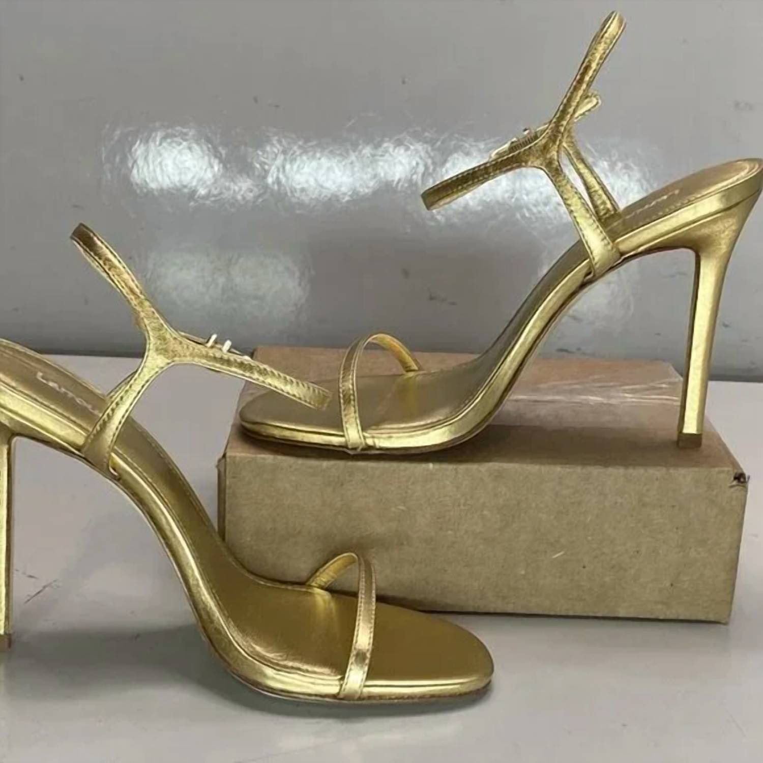 Larroude Women's Venus Stiletto Patent Leather Heel Sandals in gold - women's sandal - detail view