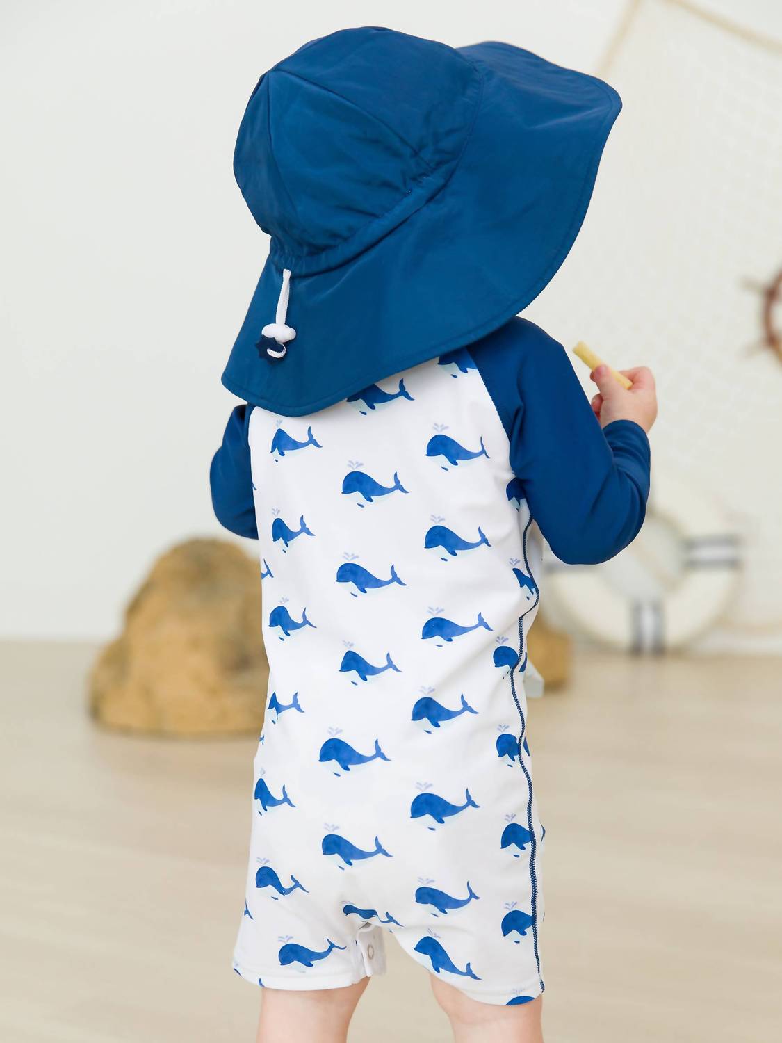 RuffleButts Kid's Whale Long Sleeve One Piece Rash Guard in blue - kids' item - alternate view