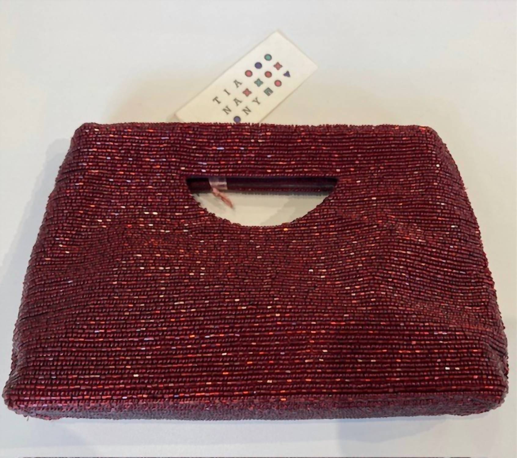 Tiana - Cutout Handle Linear Bead Clutch
