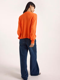 Brodie Cashmere Piper Rib Detail Pocket Cashmere Crewneck Top in neon orange - women's long sleeve top - detail view
