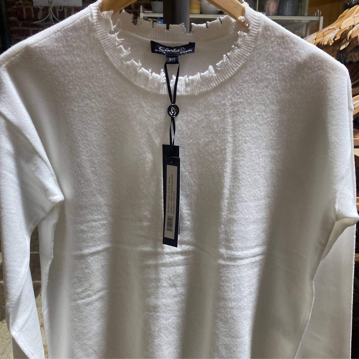 CHARLIE B Crew Neck Drop Shoulder Sweater With Frayed Edge Details in cream - women's sweater - detail view