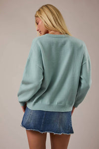 LE LIS Women's Fox Terrier Dog Graphic Sweater in mint green - women's sweater - detail view