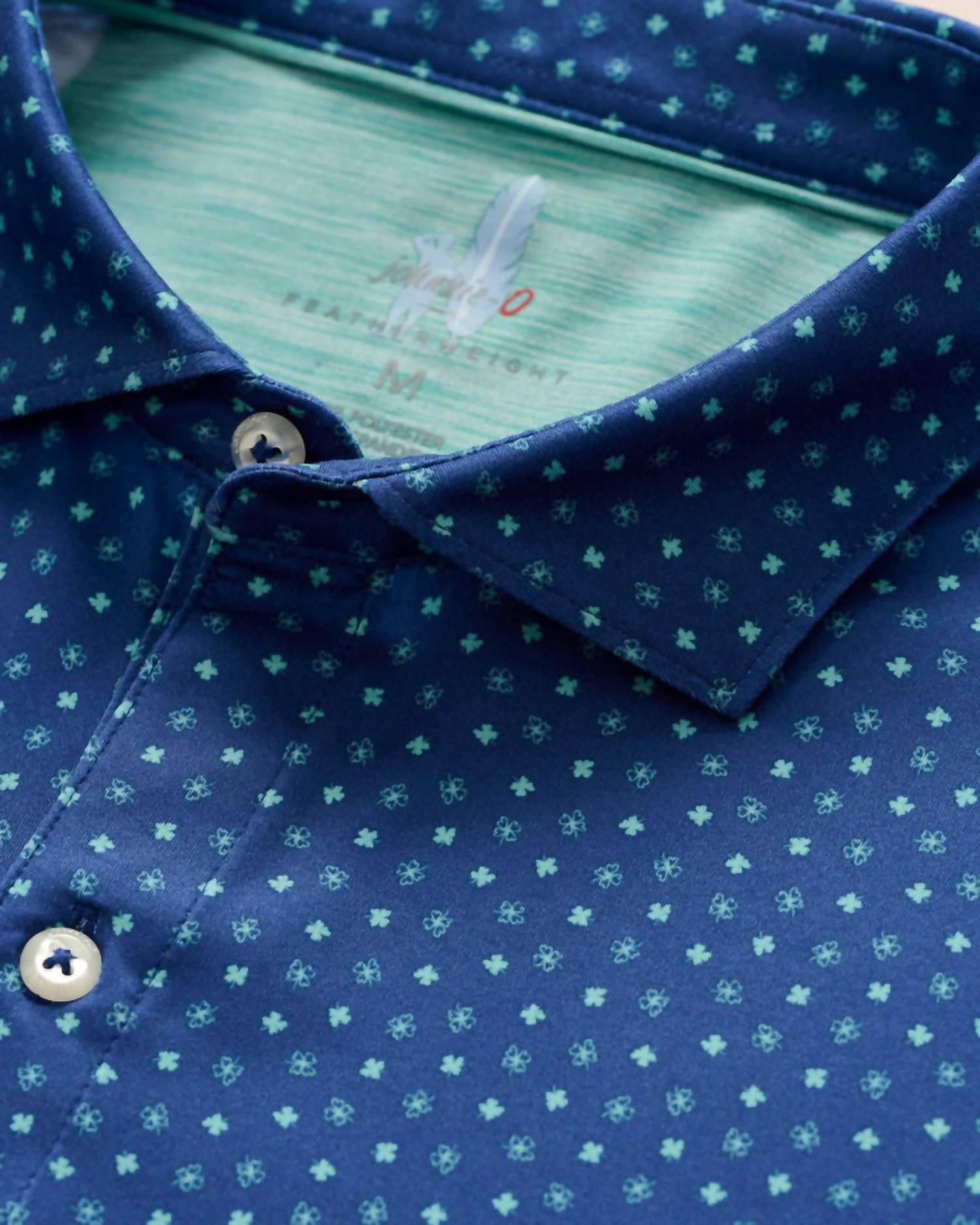 JOHNNIE-O Boy's Featherweight Performance Polo in shamrocks - kids' shirt - detail view