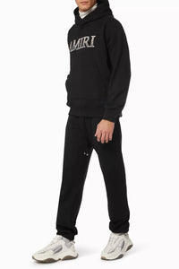 Amiri Leopard Applique Sweatpants in black - men's pants - detail view
