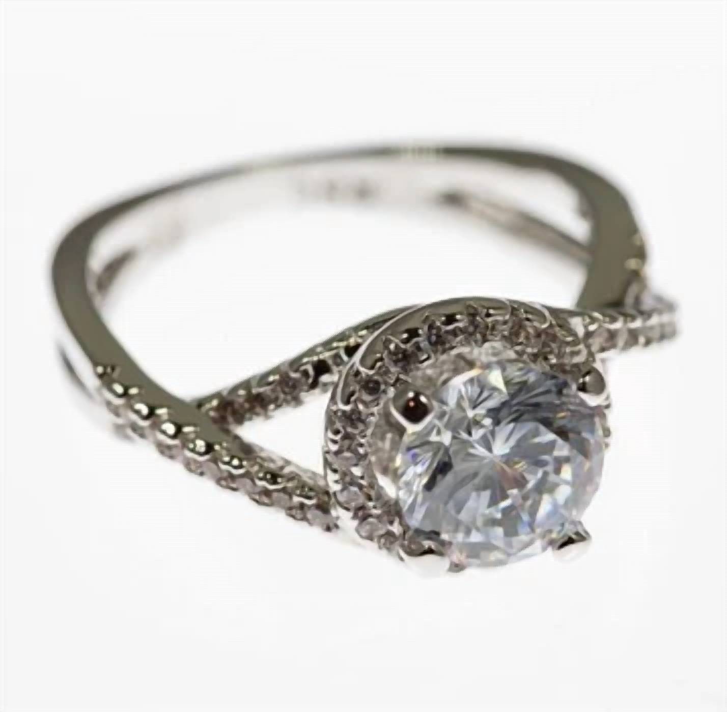 Faire - TWISTED SOLITAIRE CZ RHODIUM PLATED RING