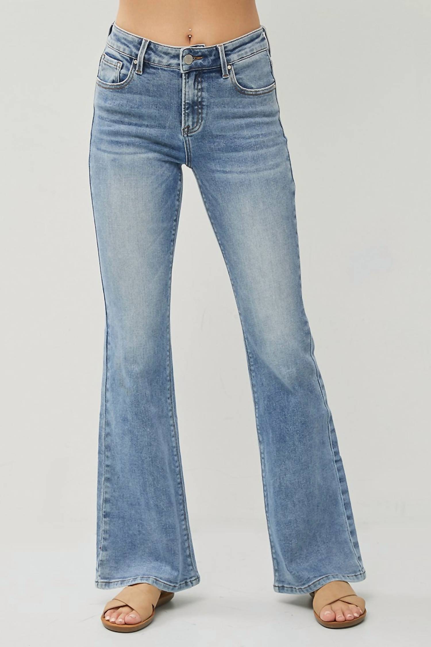 RISEN Channing Mid Rise Flare Jean in medium wash - women's jeans