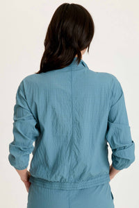 XCVI Amis Cinchable Bomber Jacket in dark knight - women's jacket - detail view