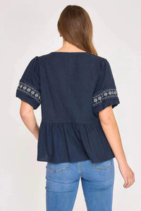 umgee Embroidered Peplum Blouse in navy - women's blouse - detail view