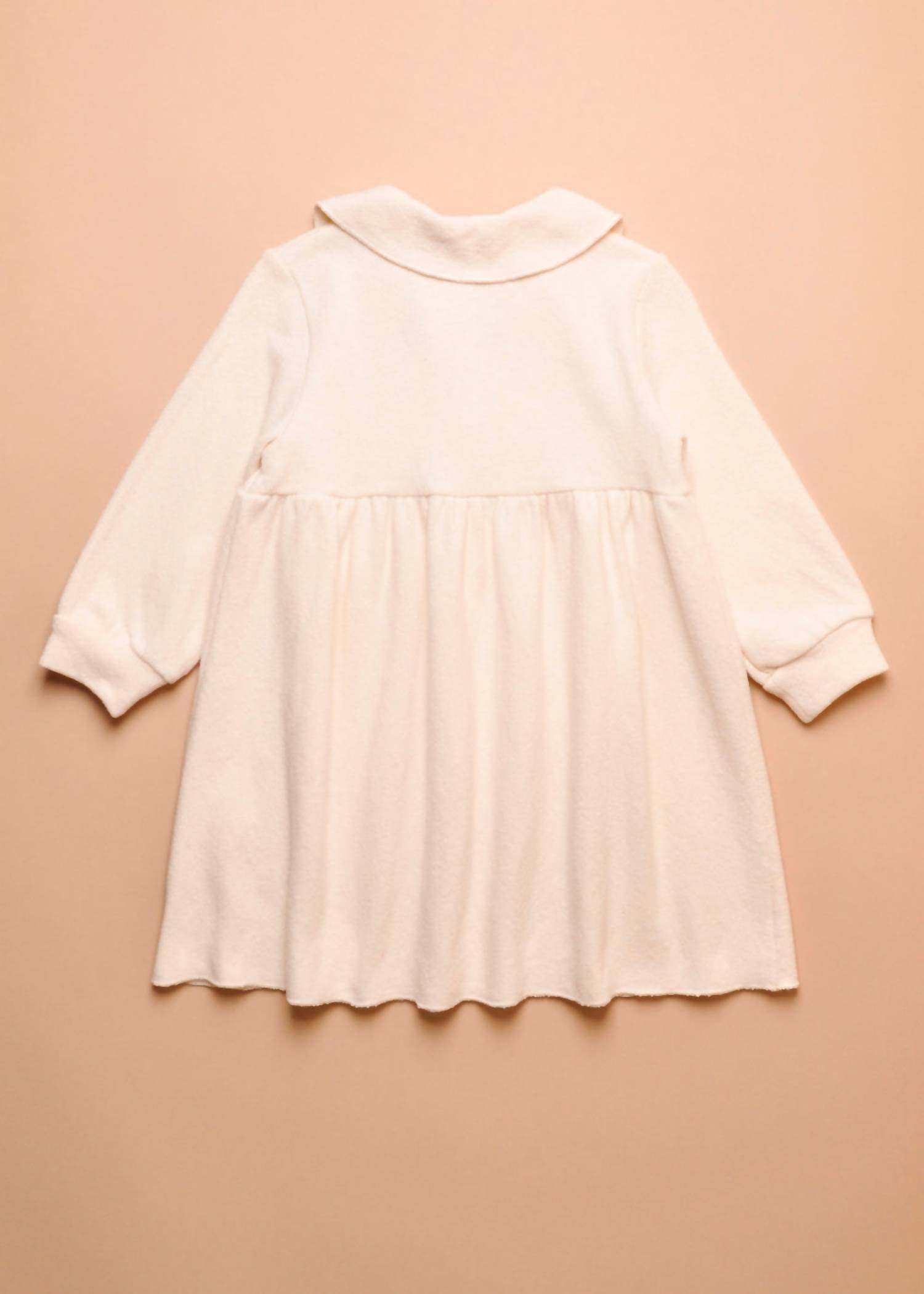 Zhoe & Tobiah Girl's Pearl Buttoned Dress in pannacotta - kids' dress - detail view