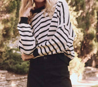 THE GREAT. Women's The Roll Neck Pullover Top in black and cream stripe - women's sweater
