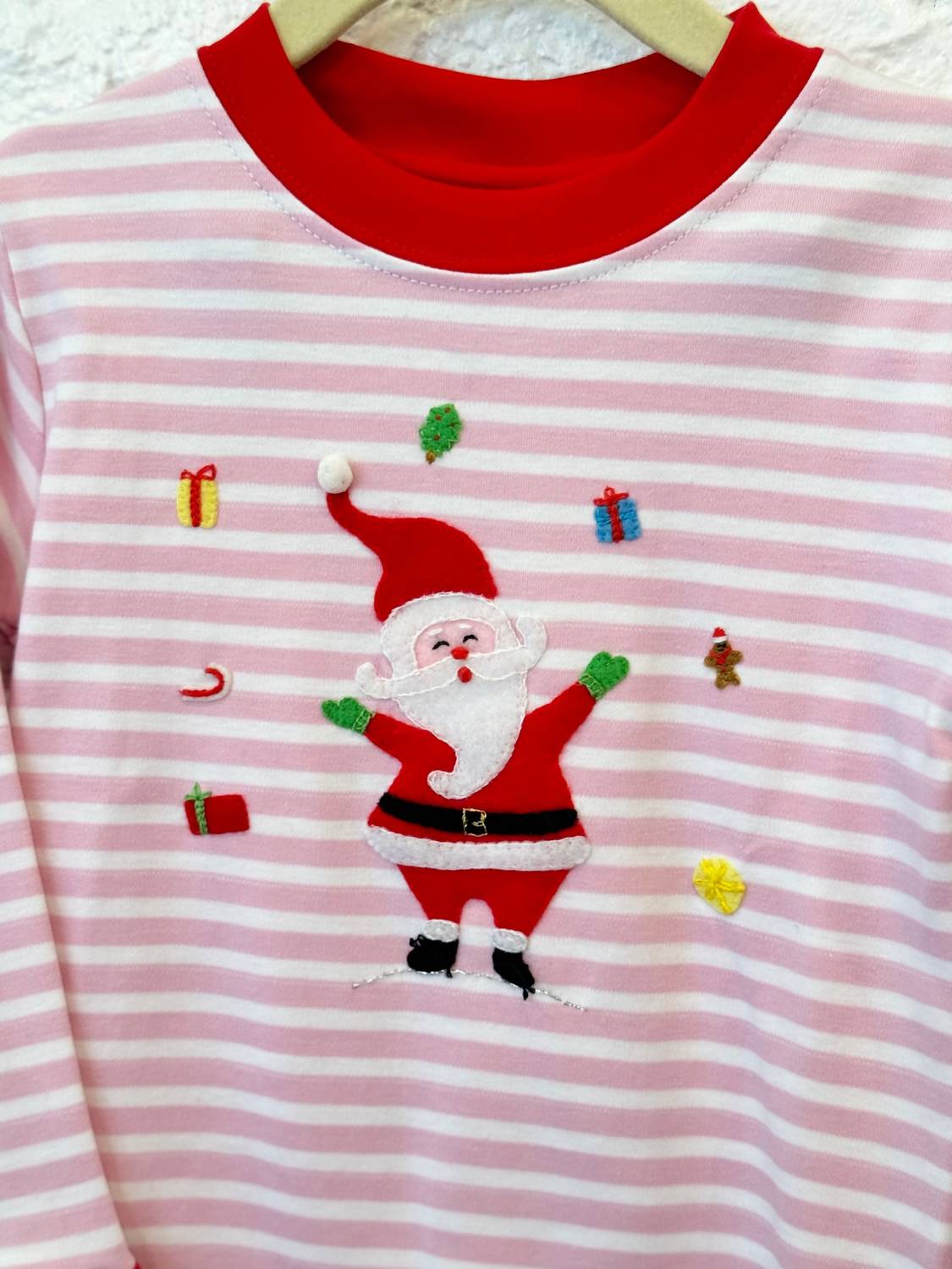 SQUIGGLES Kids Juggling Santa Pajama Set in pink - kids' sleepwear - alternate view